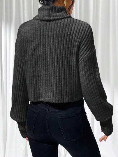 Rollkragen Top mit lockeren Ärmeln für lässigen Stil.
