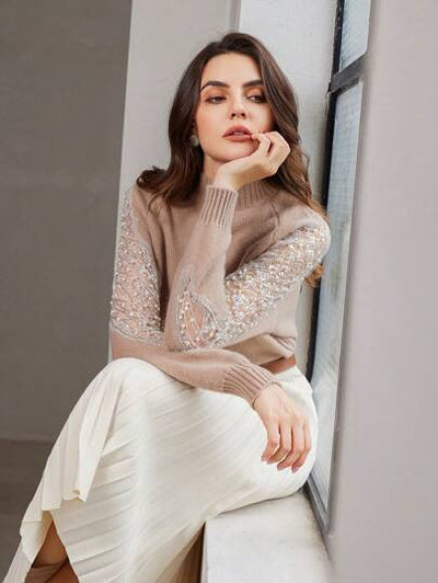 Pullover mit Perlen und Rundhalsausschnitt von Aphrodite™.
