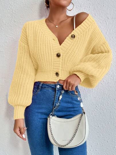 Schwarzer Knopf-Cardigan mit schickem Flair.