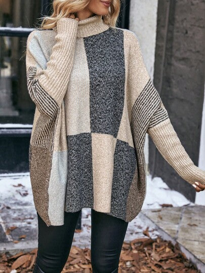 Stilvoller Pullover mit Fledermausärmeln und Farbblock-Design.
