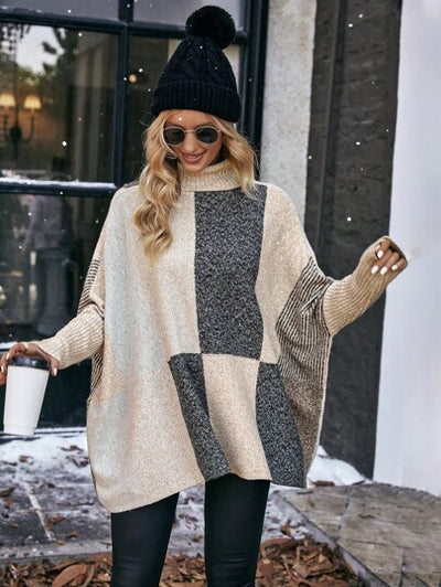 Moderner Modepullover mit Fledermausärmeln und warmem Stoff.
