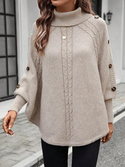 Stilvoller Pullover mit Fledermausärmeln und dekorativen Knöpfen.
