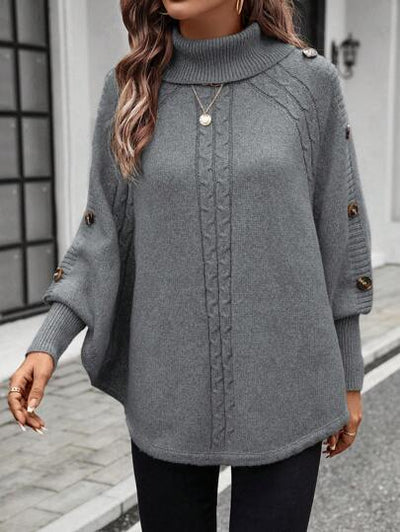Dekorative Knopfdetails auf einem gemütlichen Winterpullover.
