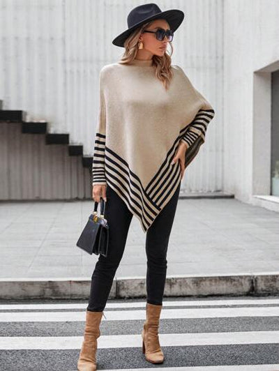 Aphrodite™ Poncho mit auffälligem Streifenmuster und asymmetrischem Saum.
